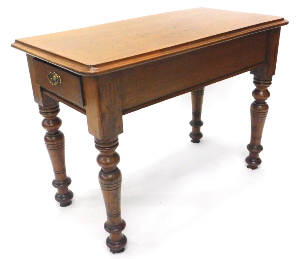 A Victorian mahogany and pitch pine side table, the rectangular top with a moulded edge, with a