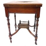 An Edwardian walnut envelope card table, the square top hinged to enclose a lined interior above a