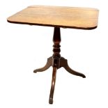 An early 19thC mahogany occasional table, the rectangular top on a turned column and tripod base,