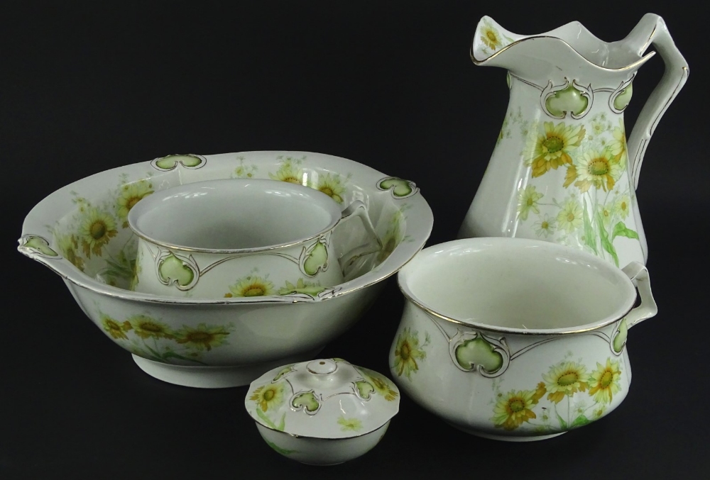A Henry Alcock & Co semi porcelain part wash stand set, each piece decorated with yellow flowers and