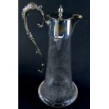 An early 20thC etched cut glass claret jug, the bell shaped body with plated mounts and scroll