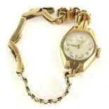 A 9ct gold J.W. Benson of London ladies wristwatch, with circular dial in Art Deco style case, on