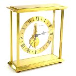 A Jaeger Le Coultre eight day mantel clock, in brushed brass case, with eight day in-line baguette