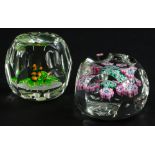 Two Whitefriars glass paperweights, one with a design of an oak leaf and acorns, the other with