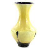 An Art Glass vase, with mottled tailed type decoration, on a cream coloured ground, possibly Royal