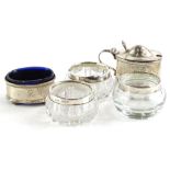 A collection of small silver, to include three glass salts, with silver collars, mustard pot and