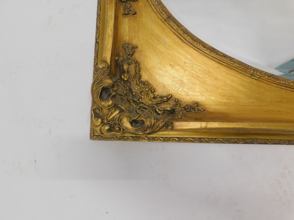 A gilt rectangular wall mirror, with an oval bevel plate, 75cm x 150cm. - Image 2 of 2