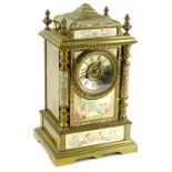 An early 20thC French gilt brass and champleve enamel mantel clock, the silvered dial with Roman