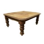 A Victorian mahogany extending dining table, with double moulded top, on turned and tulip carved
