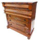 A Victorian figured mahogany chest of drawers, with an inverted breakfront top and an arrangement of