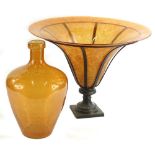 A modern glass centrepiece, the amber tinted bowl decorated to simulate butterfly wings, 49cm dia.