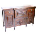A Victorian walnut breakfront sideboard, the top with a moulded cornice above two drawers flanking a