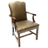 A mahogany open armchair in George III style, with a brown leatherette padded back seat, on