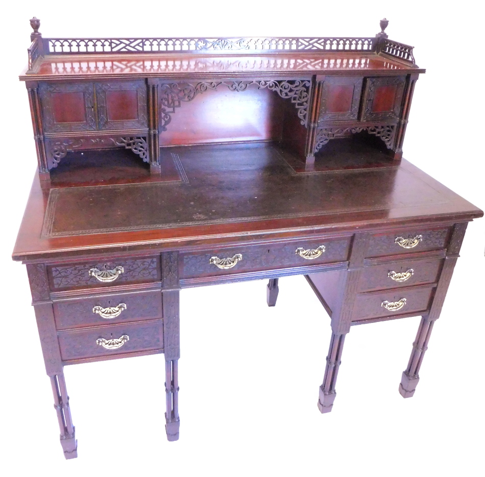 A late 19th/ early 20thC Edwards and Roberts writing table, in Chippendale style, the raised back