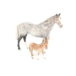 A Beswick pottery figure of a grey gloss horse, together with a Beswick donkey (2).