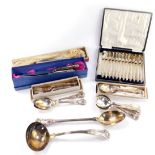 Silver plated flatware decorated in the King's pattern, including a soup ladle and basting spoon,