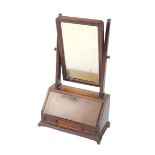 A George II walnut and burr walnut toilet mirror, the swing frame mirror over a fall flap opening to