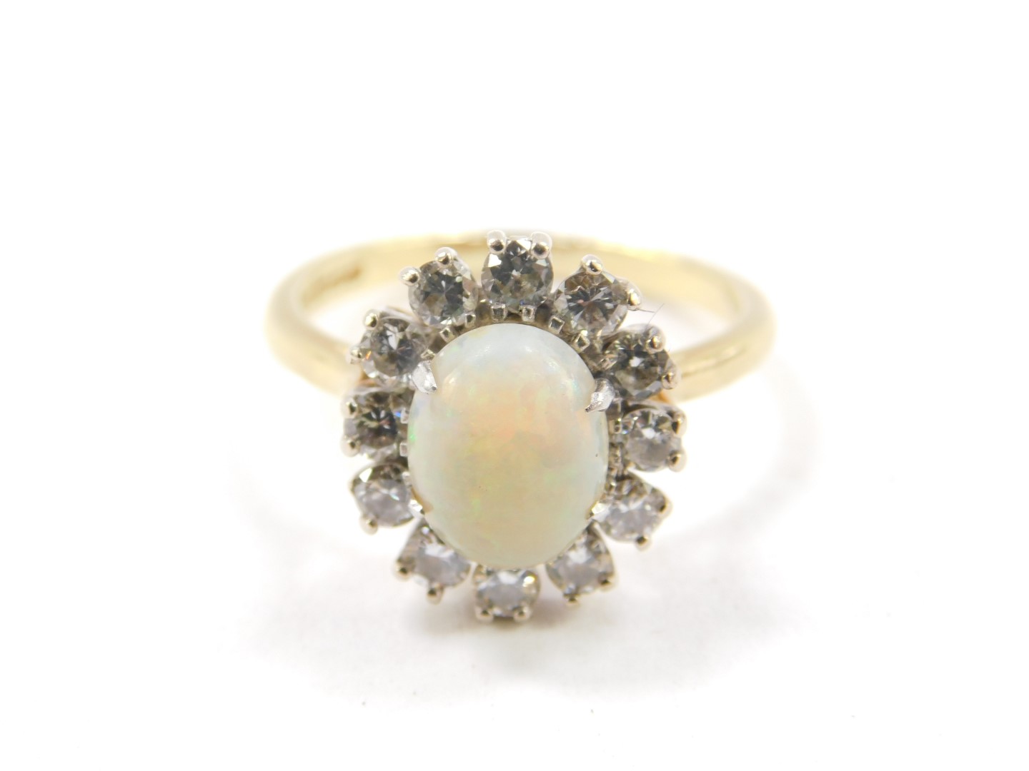 An 18ct gold opal and diamond ring, the opal set in a surround of twelve brilliant cut diamonds, - Image 2 of 2