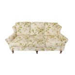 A Hallmark Designs three seater Alison sofa, upholstered in a rose and floral patterned fabric