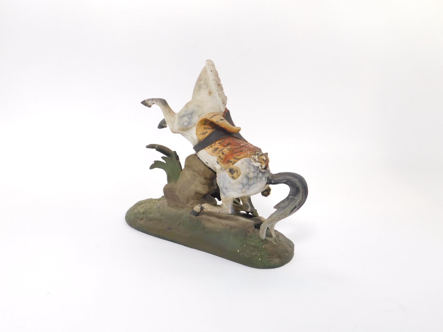 An early 20thC cold painted lead figure of a prancing horse, draped in a tiger skin, on a - Image 3 of 3