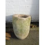 A stone crucible, of cylindrical tapering form, 54cm H.