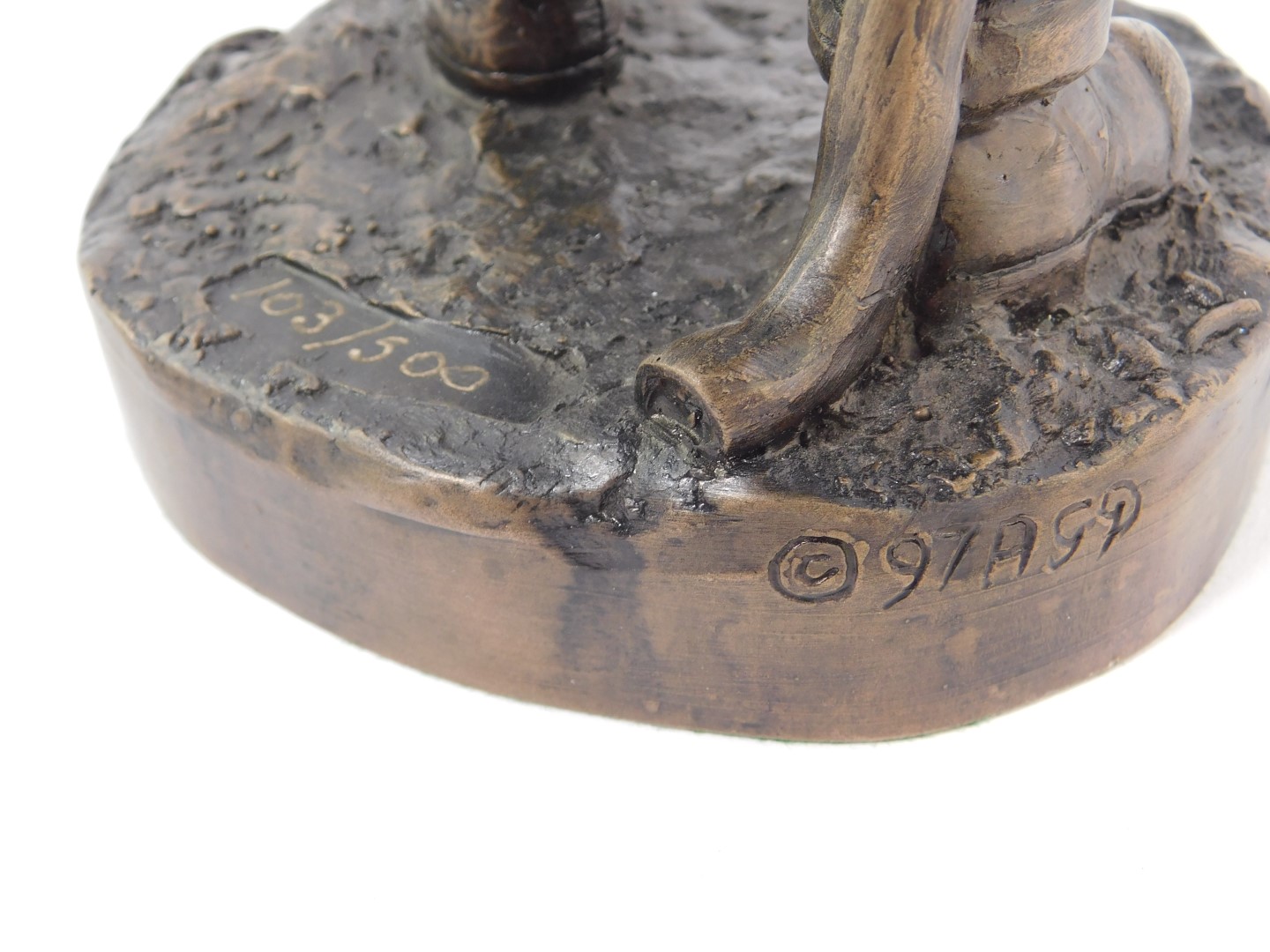 A late 20thC bronzed plaster figure modelled as a fire fighter, raised on a circular base, limited - Image 3 of 3