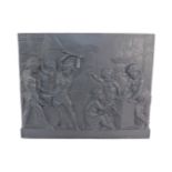 A cast iron rectangular wall plaque, signed A Carrier, cast in high relief with putti engaged in