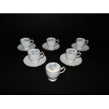 A set of six Aynsley early 20thC porcelain coffee cans and saucers, painted and gilded with rose