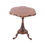 A Victorian burr walnut occasional table, the rounded six sided top, raised on a turned and leaf