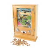 An oak cased penny arcade horse racing game, by Parkers Automatic Supplies Ltd, 38 West Parade,