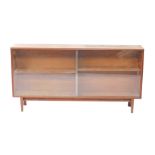 A Beaver and Tapley teak bookcase, with two sliding glass doors opening to reveal four shelves,