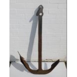 A green painted cast iron anchor, 110cm H.