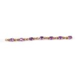 A 9ct gold and amethyst bracelet, set with seven emerald cut amethysts, on a snap clasp, 14.9g all