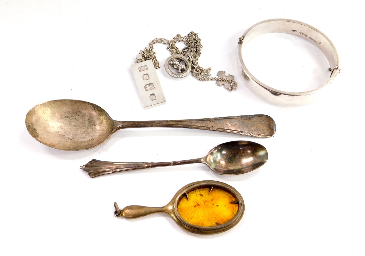 A George V silver spoon, Sheffield 1911, silver coffee spoon, silver bangle with engraved floral and