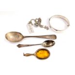 A George V silver spoon, Sheffield 1911, silver coffee spoon, silver bangle with engraved floral and
