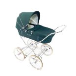 A Silver Cross pram, with a green basket and levered hood, white metal frame, 115cm H, 111cm W, 56cm