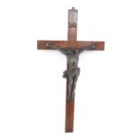 A late 19thC French crucifix, the plaster model of Christ on a wooden cross, 104cm H, 55cm W.