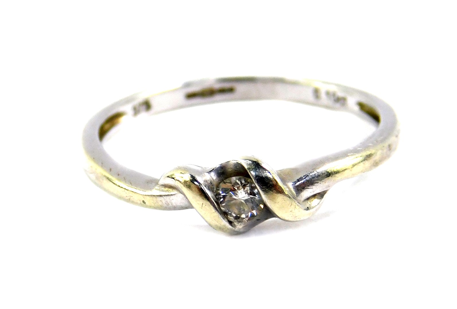 A 9ct gold and diamond ring, in a crossover design, size M, 1.7g all in.