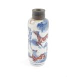 A Chinese 18thC porcelain snuff bottle, decorated in blue and white and iron red with horses,