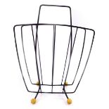 A vintage twin division atomic magazine rack, raised on four ball feet, 41cm H.