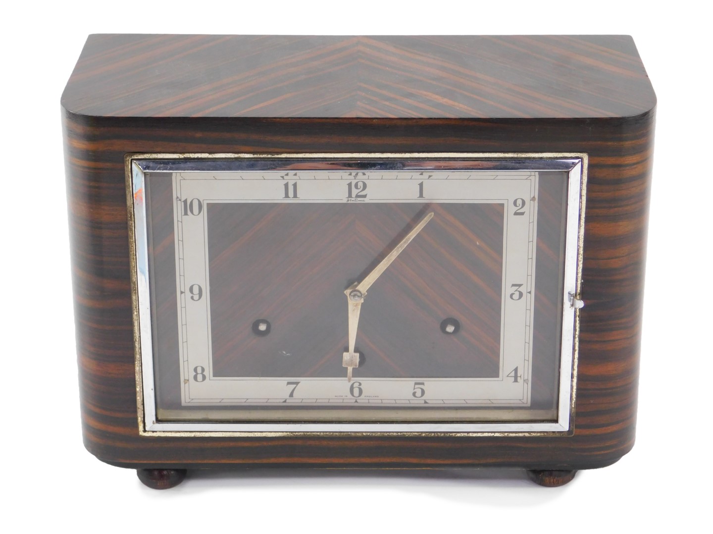 A Bentima Art Deco coromandel cased mantel clock, the rectangular dial with silvered chapter ring