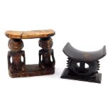 A Kuba wooden neck rest, carved with two kneeling figural supports, on an oval base, 18cm W, and a