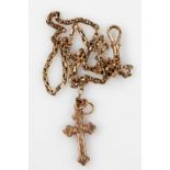 A 9ct gold crucifix and chain, 7.9g.