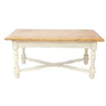 A pine and painted pine kitchen table, the four planked top raised on turned supports and feet,