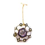 A 9ct gold amethyst and seed pearl brooch, in a wheel design, with safety chain as fitted, 4.4g
