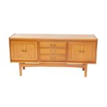 A William Lawrence of Nottingham teak sideboard, with three central drawers flanked by two