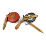 A Rabone Chesterman metal wind out tape measure, leather cased, with brass plumb line, together with