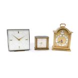 A Swiza Tempus Fugit brass cased mantel clock, 11cm W, a further Swiza mantel clock, with a square