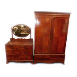 A Maple & Company mahogany double wardrobe, with quartered and herringbone veneers, the outswept