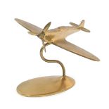 A brass desk stand modelled as a spitfire, 18.5cm W.